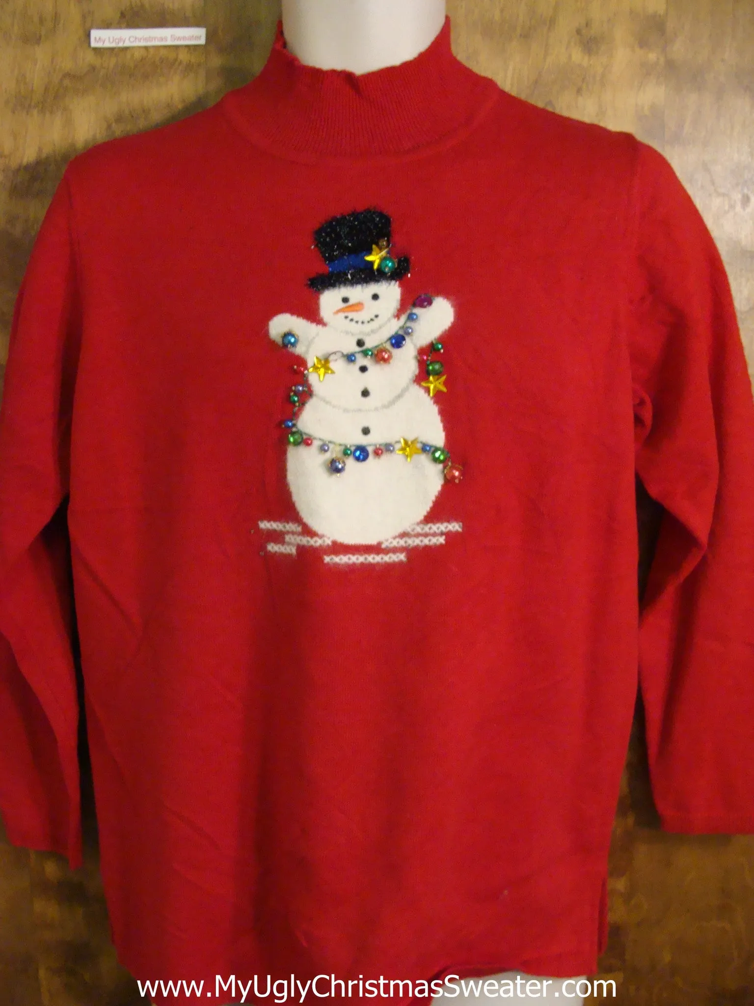 Holiday Sweater with a Happy Snowman Wrapped in Bling